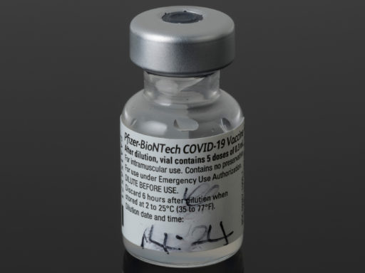 The first vial of COVID vaccine used in a mass immunisation programme