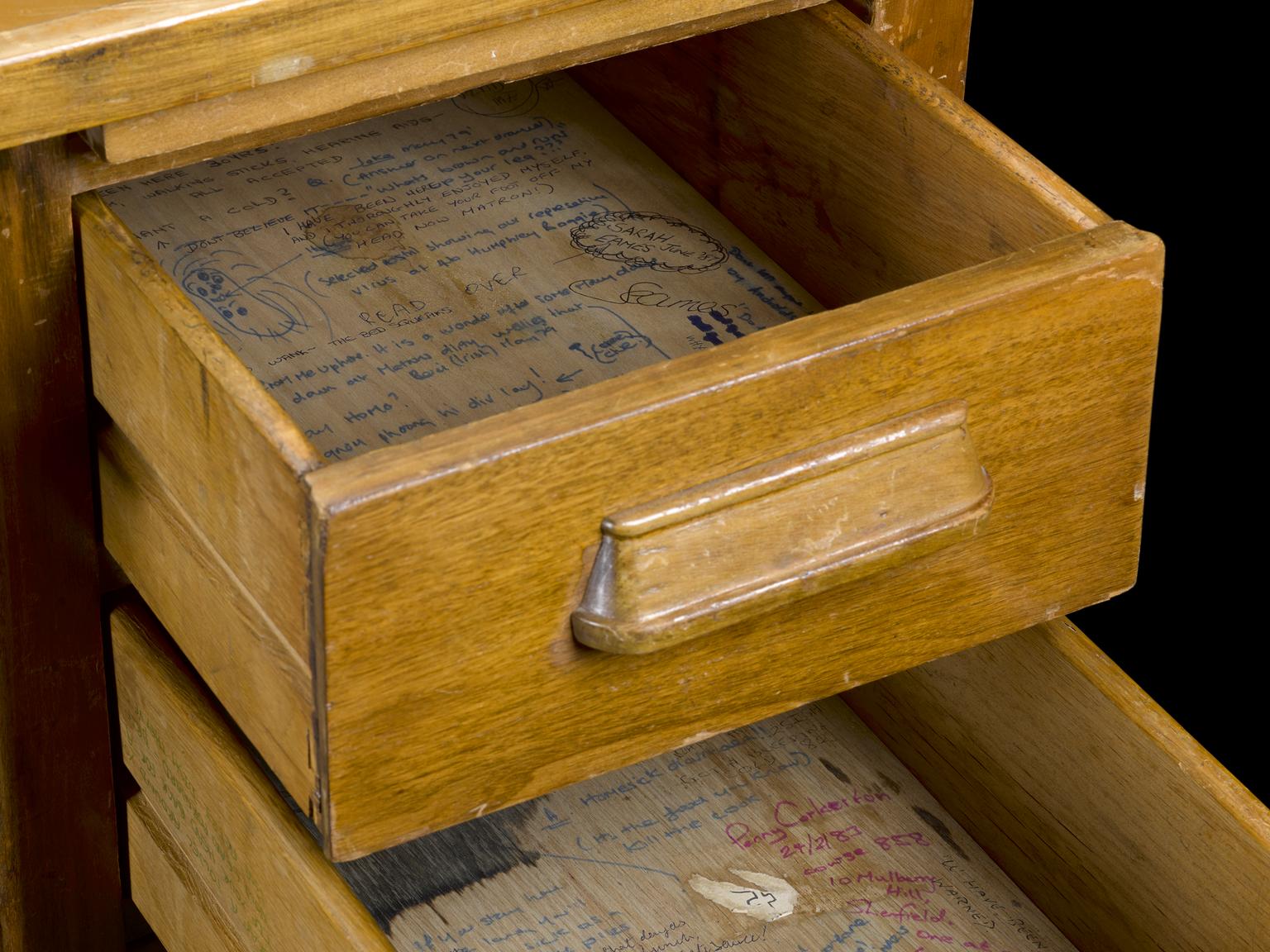 Graffiti covered draw from a desk