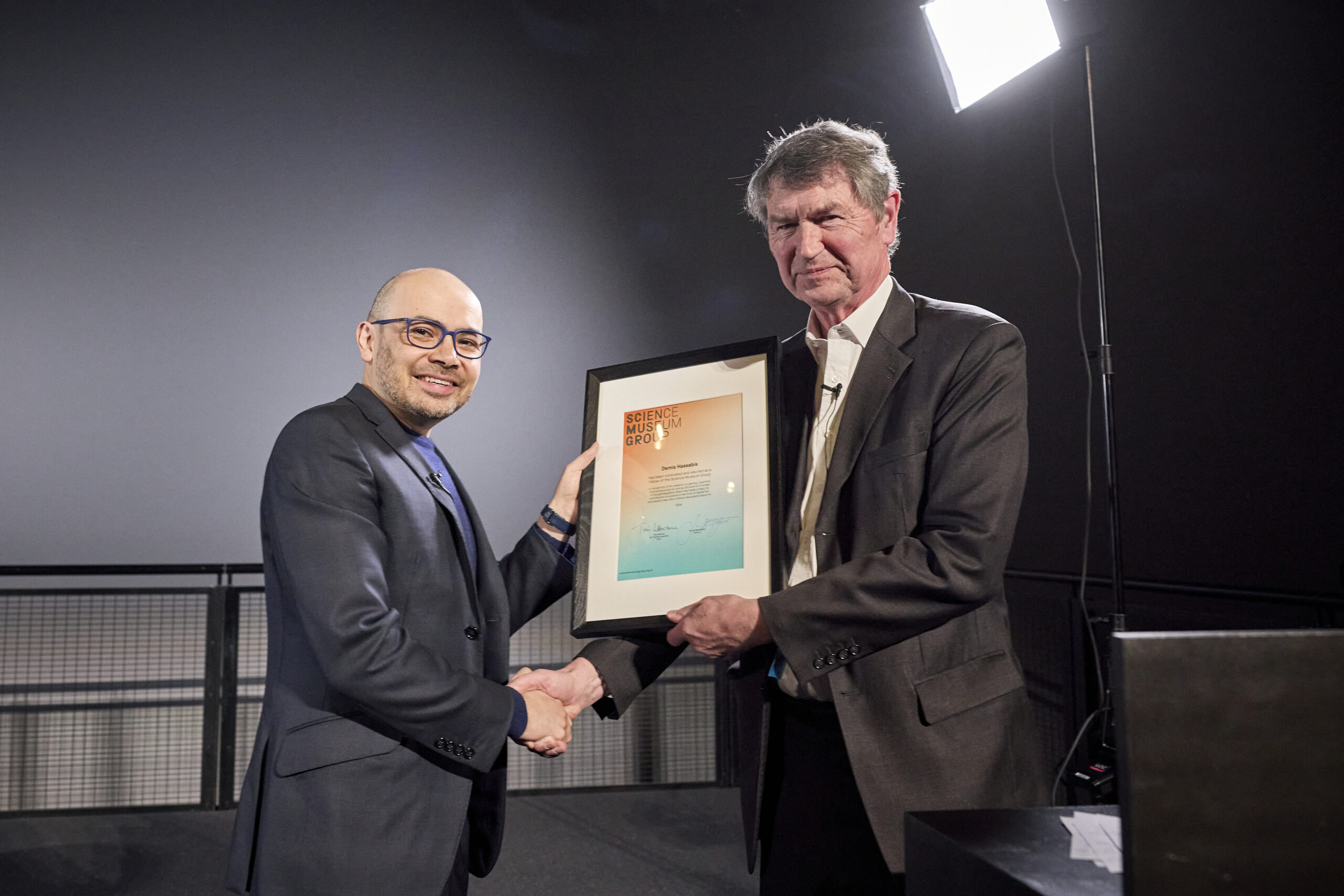 Sir Demis Hassabis, CEO and Co-Founder of GoogleDeepMind, accepts a Science Museum Group Fellowship from Science Museum Group Chairman Sir Tim Laurence (pictured right). Image credit: Ben Catchpole for Google DeepMind